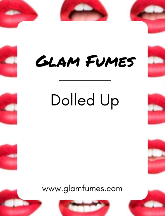 Product image featuring multiple lips with the product name 'Glam Fumes - Dolled Up' perfume and body oil displayed across the center.