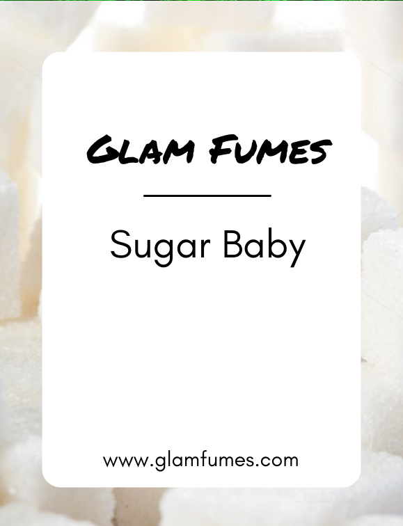A product image featuring a label with 'Glam Fumes' branding and the words 'Sugar Baby' perfume and body oil beneath it, against a background that appears to be a pile of white sugar crystals.