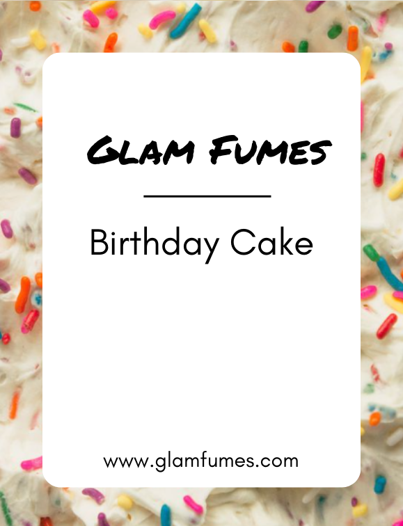 A bottle of perfume or body oil with the cap removed, labeled 'Glam Fumes Birthday Cake', placed on a surface with colorful sprinkles scattered around.